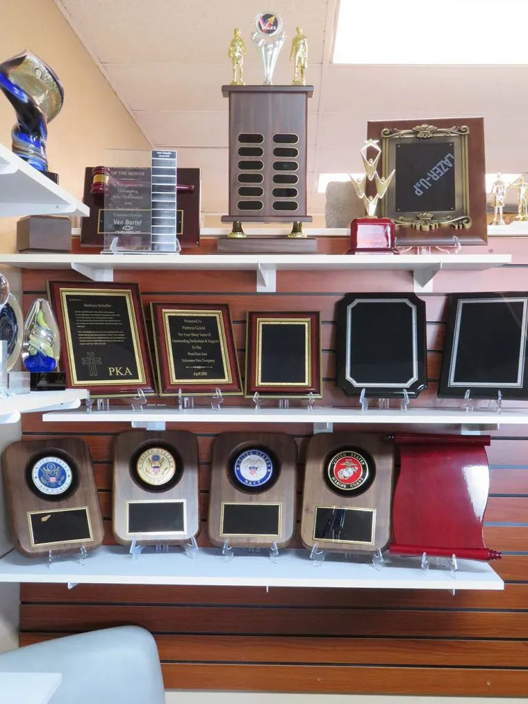 plaques on shelving on wall